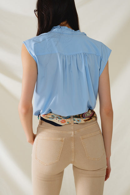 Blusa abotonada azul sin mangas con cuello mao