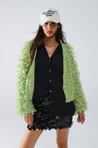 Chaqueta verde con textura y flecos largos