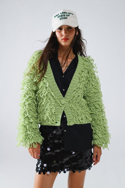 Chaqueta verde con textura y flecos largos