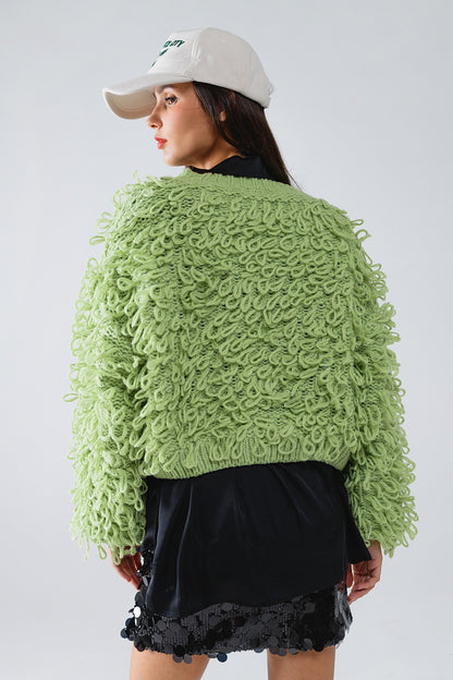 Chaqueta verde con textura y flecos largos