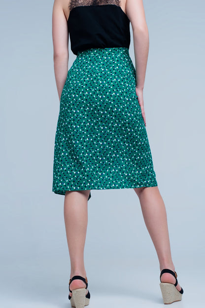 Falda midi verde con estampado floral de lunares y detalle de volante