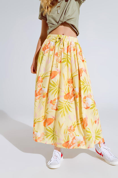 Q2 maxi falda amarilla con estampado tropical