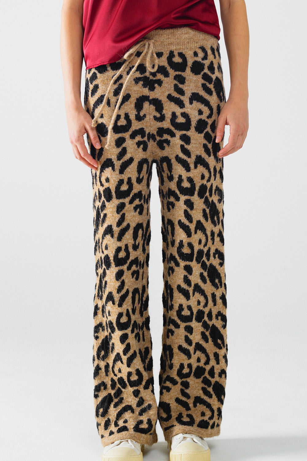 Pantalón con estampado de leopardo punto elástico y detalle de cordón