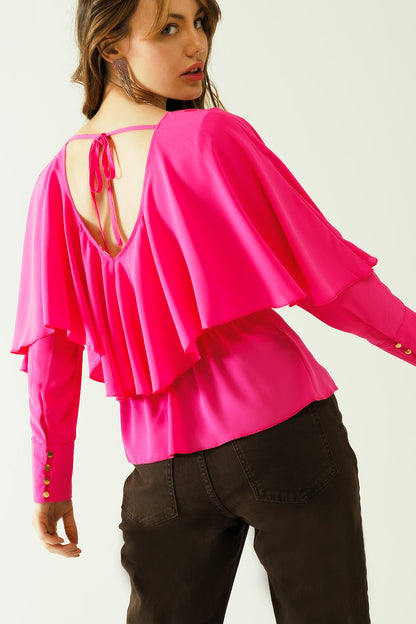 Top con cuello en V puños abotonados y lazo en la espalda en color fucsia